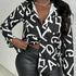 Ladies' fashionable shirt with English letter print, long sleeveless, casual style.