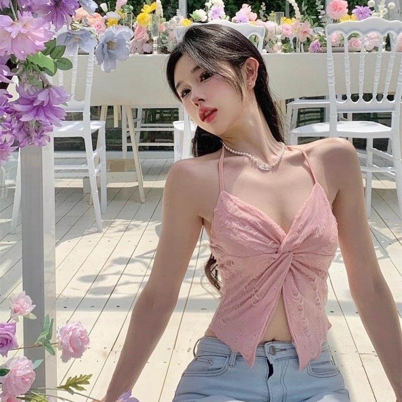 Pink Niche Kink Halter Tank Top in polyester, styled sweetly with floral background.