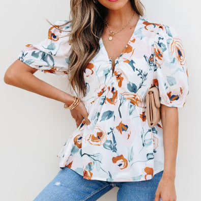 Green floral print puff sleeve V-neck babydoll blouse.